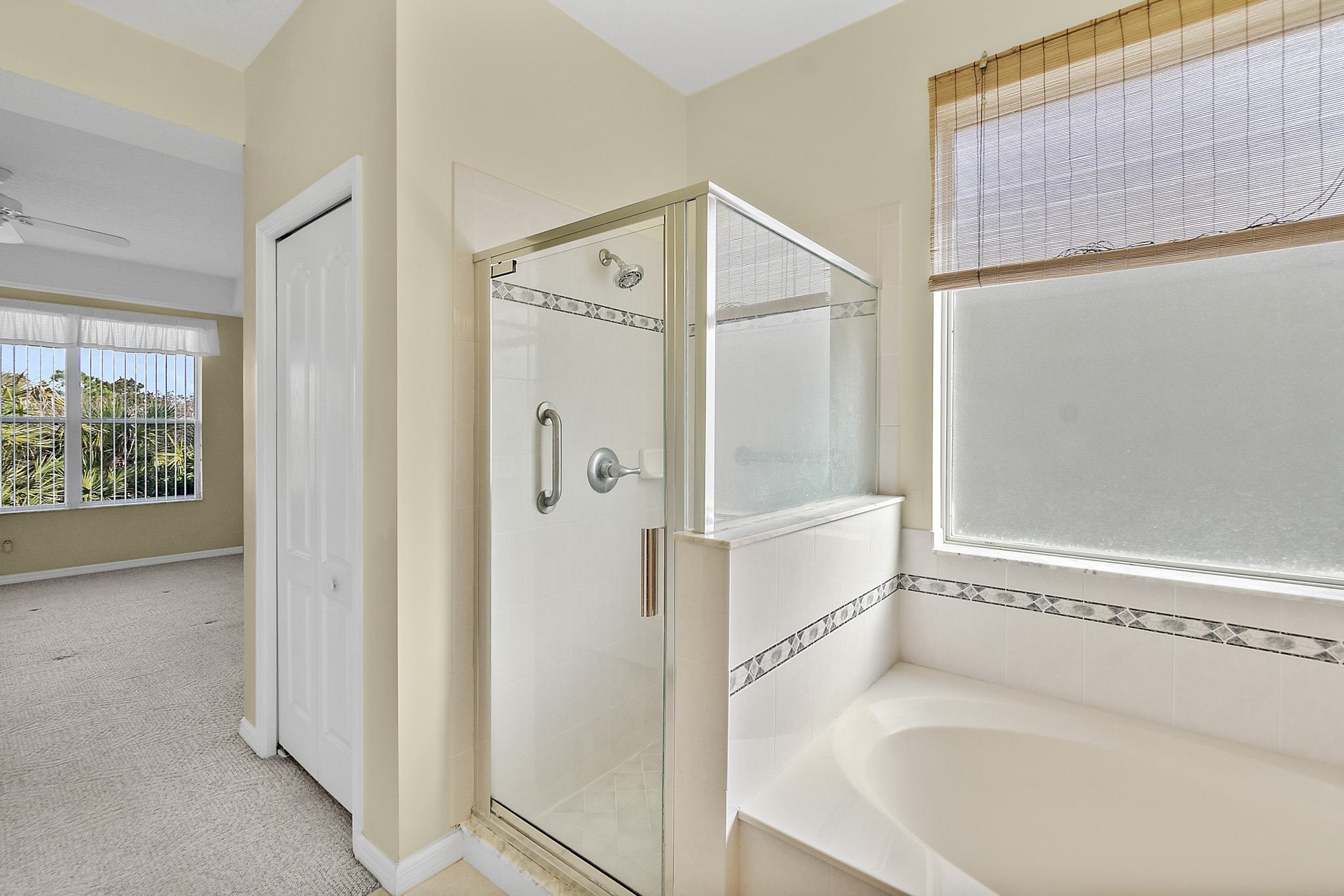 644 Casa Fuerta Lane St. Augustine, FL 32080 - Photo 31 of 49 a bathroom with a bathtub and a shower