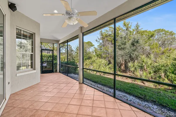 a view of a porch with a floor to ceiling windows