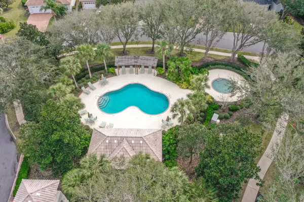 an aerial view of a house with outdoor space and street view