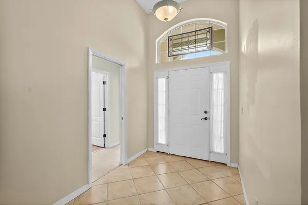 a view of a hallway with front door