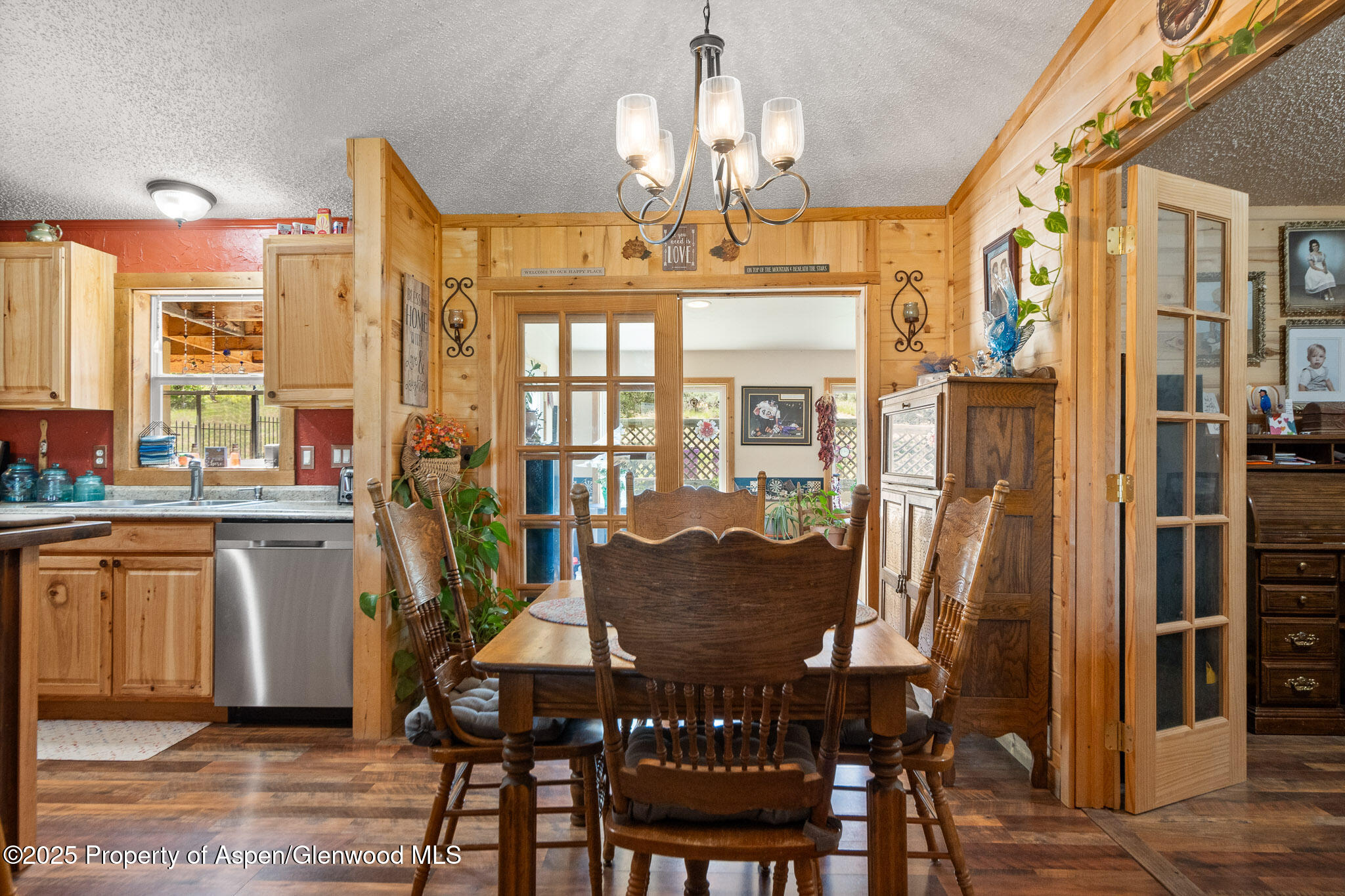 3768 County Road 237 Rifle, CO 81650 - Photo 11 of 47 a view of a dining room with furniture window and wooden floor