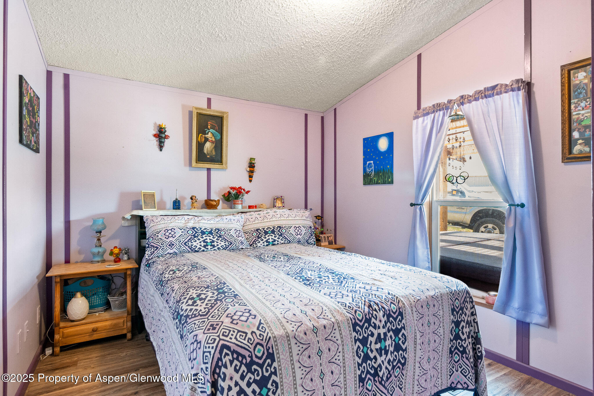 3768 County Road 237 Rifle, CO 81650 - Photo 22 of 47 a bedroom with a bed and a window