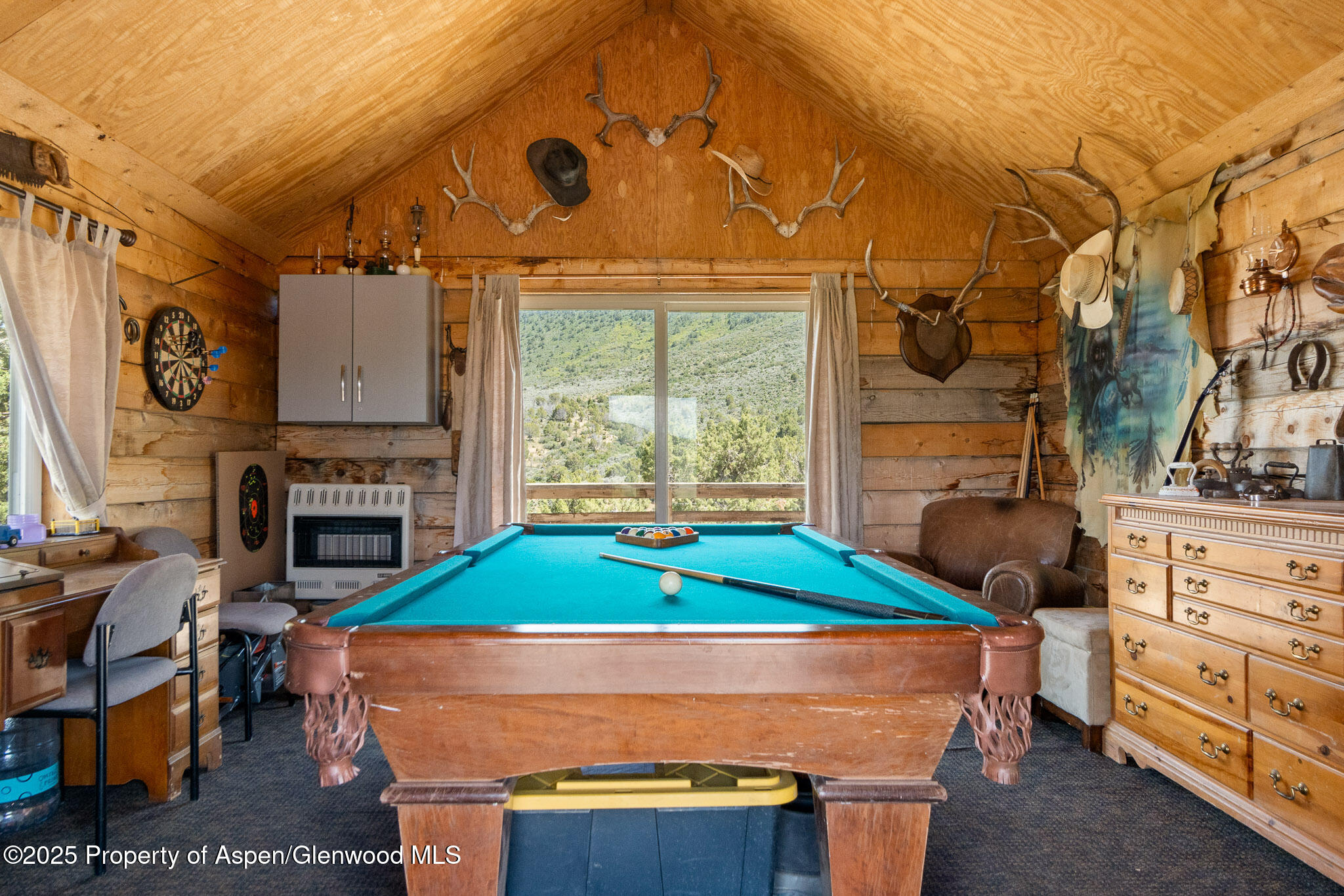3768 County Road 237 Rifle, CO 81650 - Photo 27 of 47 a room with fireplace furniture and a window