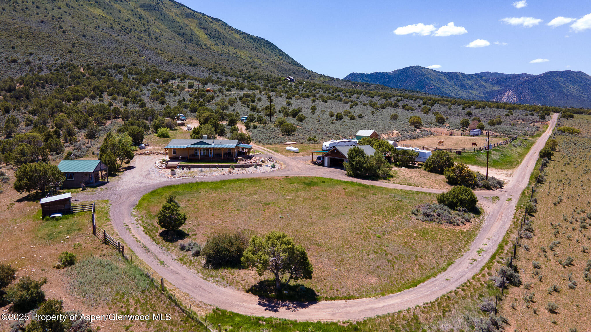 3768 County Road 237 Rifle, CO 81650 - Photo 37 of 47 a view of a swimming pool with a yard and mountain view