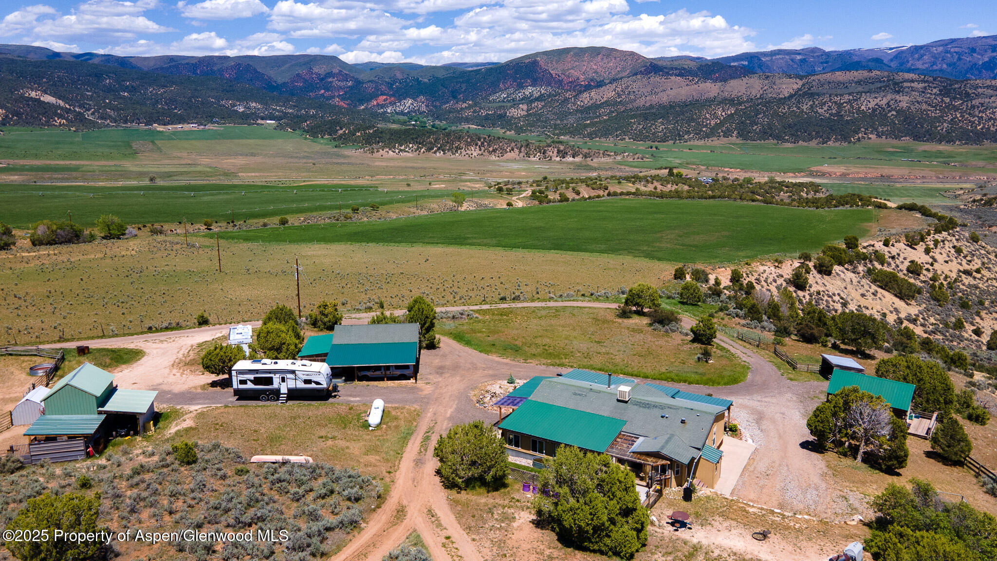 3768 County Road 237 Rifle, CO 81650 - Photo 6 of 47 an aerial view of a house with a garden and lake view