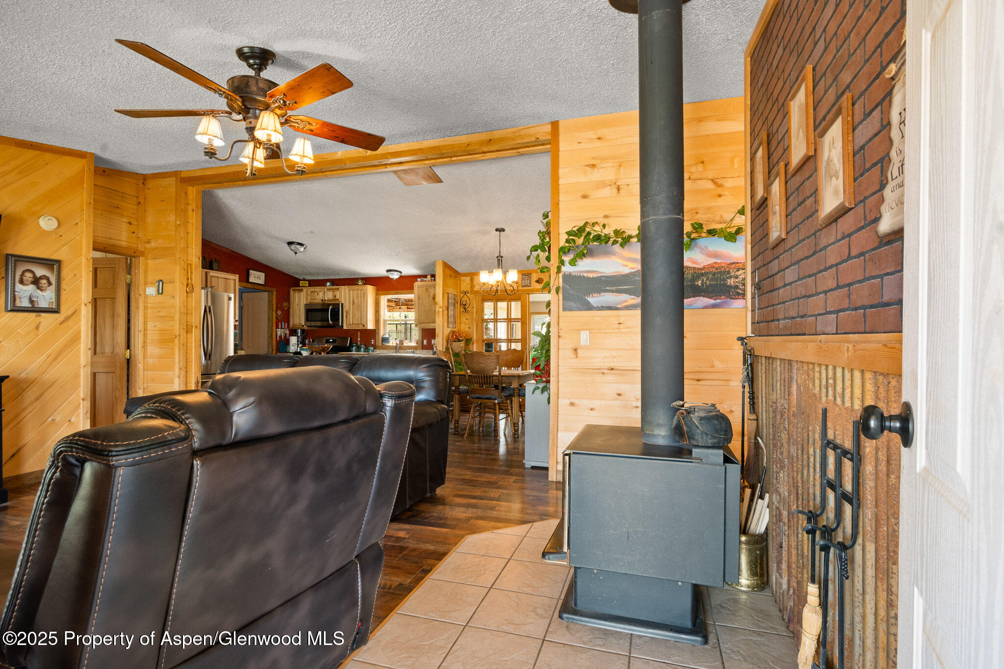 3768 County Road 237 Rifle, CO 81650 - Photo 9 of 47 a living room with furniture and a floor to ceiling window