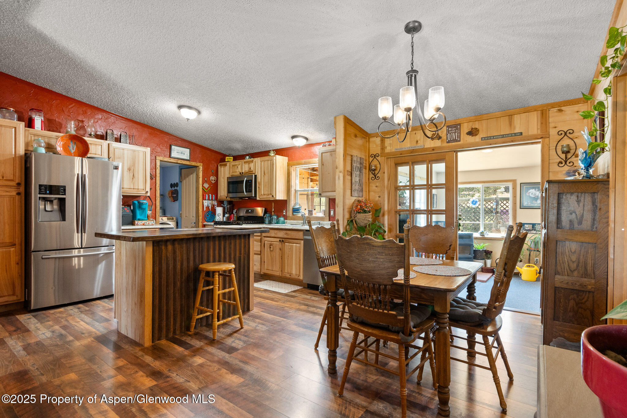 3768 County Road 237 Rifle, CO 81650 - Photo 10 of 47 a view of a dining room with furniture window and wooden floor