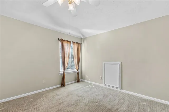 a bathroom with a toilet sink vanity and mirror