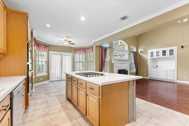 a kitchen with a stove and a refrigerator