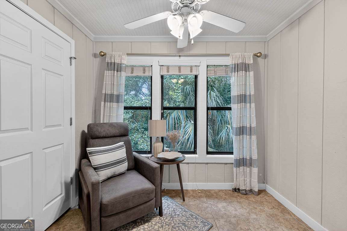 2514 Demere Road, Unit 7 St. Simons, GA 31522 - Photo 11 of 22 a living room with furniture and a window