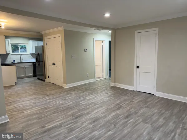 a view of a kitchen from the hallway