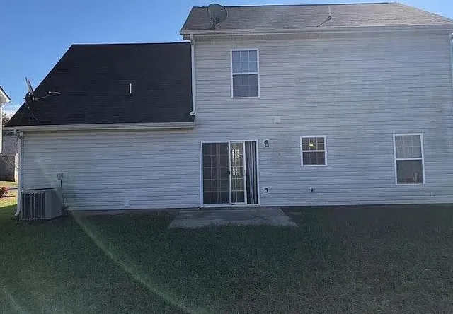 a brick house with a yard