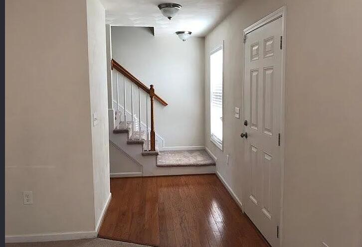 640 Old Fort Road Rocky Mount, VA 24151 - Photo 3 of 20 a view of a hallway with wooden floor and staircase