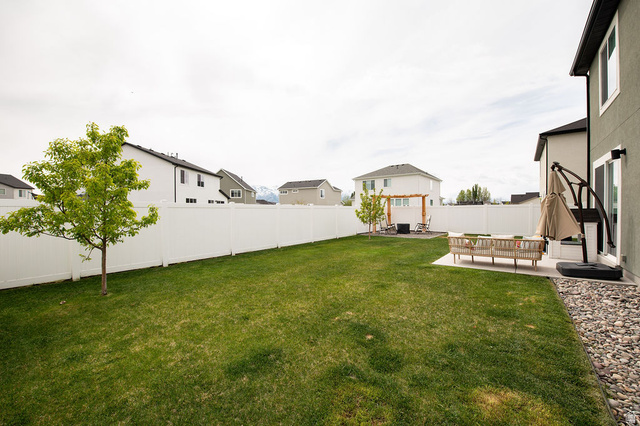 384 Ropelato Drive Nibley, UT 84321 - Photo 20 of 25 Fenced backyard featuring a patio and a residential view