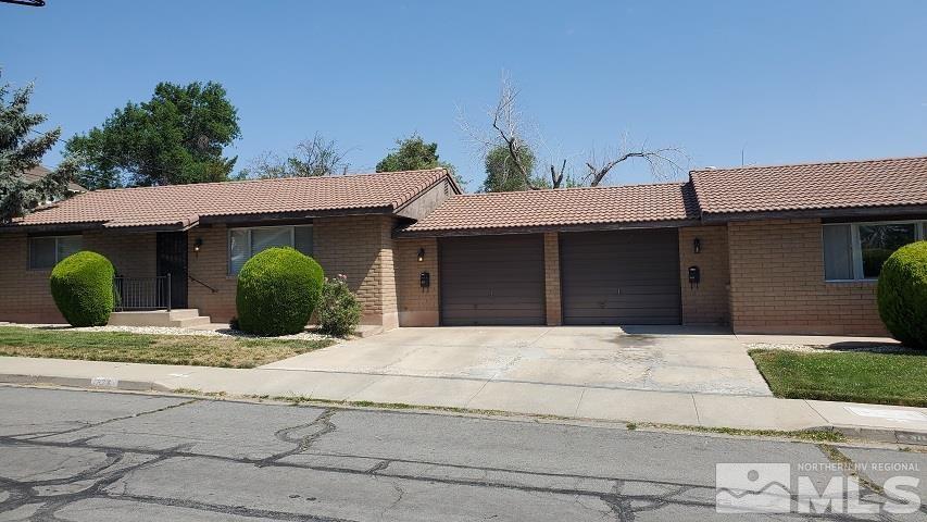 605 Lander Street Reno, NV 89509 - Photo 1 of 17 a front view of a house with garden