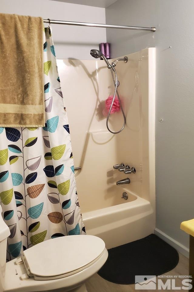 605 Lander Street Reno, NV 89509 - Photo 11 of 17 a bathroom with a bathtub and shower