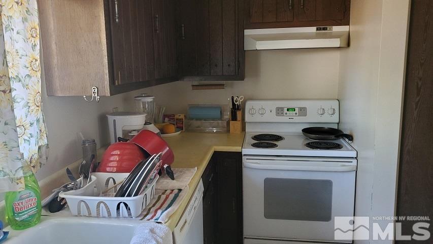 605 Lander Street Reno, NV 89509 - Photo 7 of 17 a utility room with dryer washer and a view of kitchen