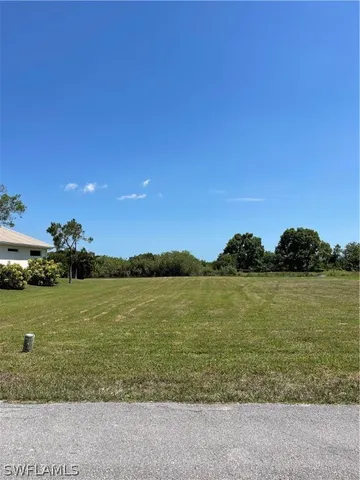a view of a lake with a yard