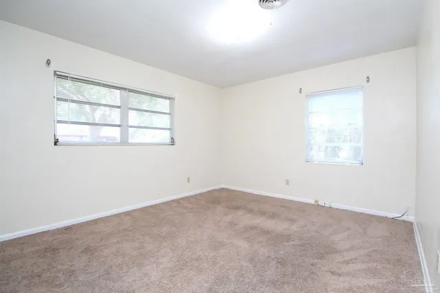 an empty room with windows