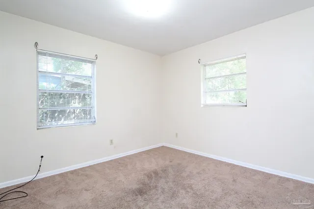 an empty room with windows