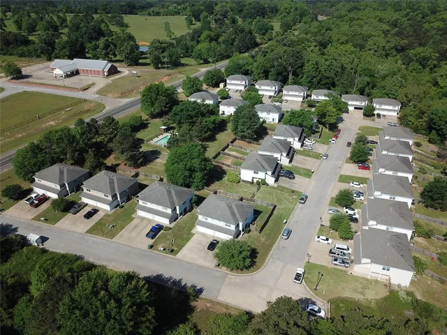 an aerial view of residential houses with outdoor space