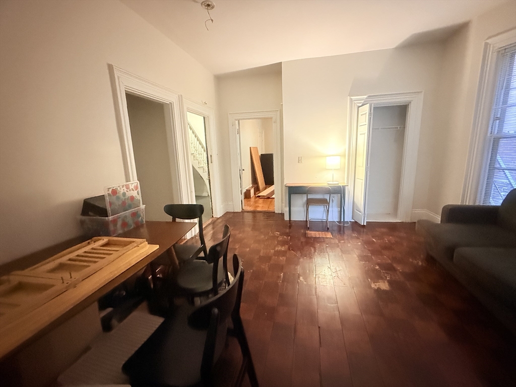 23 Inman Street, Unit 1 Cambridge, MA 02139 - Photo 13 of 20 a view of a workspace with furniture and a window