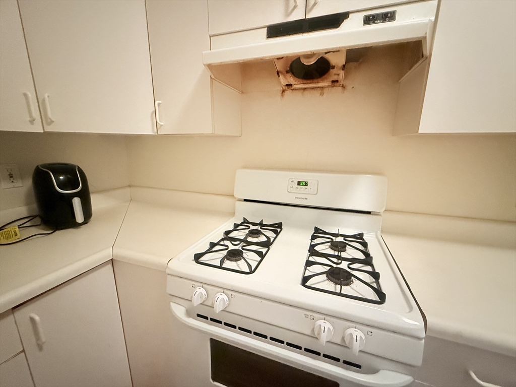 23 Inman Street, Unit 1 Cambridge, MA 02139 - Photo 15 of 20 a close view of a sink a stove and kitchen in it