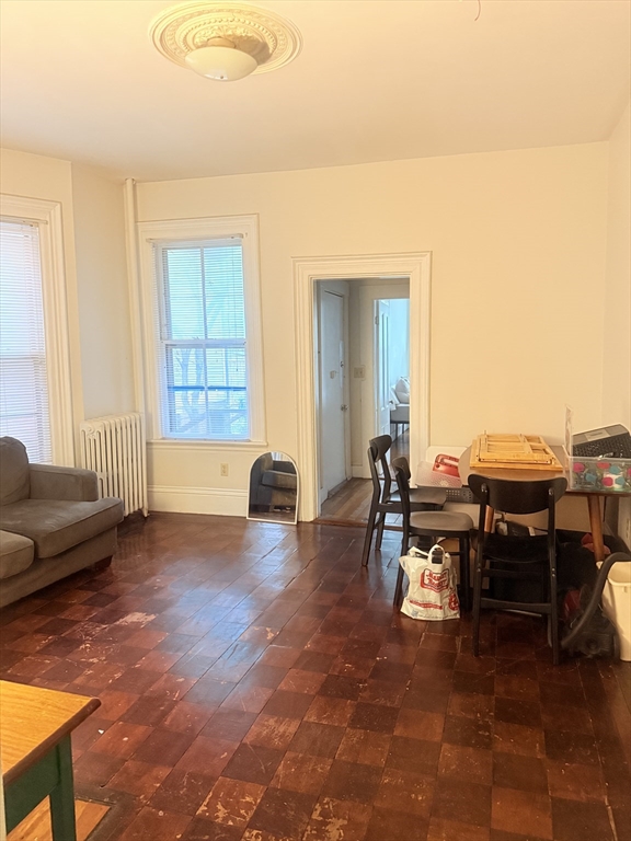 23 Inman Street, Unit 1 Cambridge, MA 02139 - Photo 20 of 20 a living room with furniture and a window