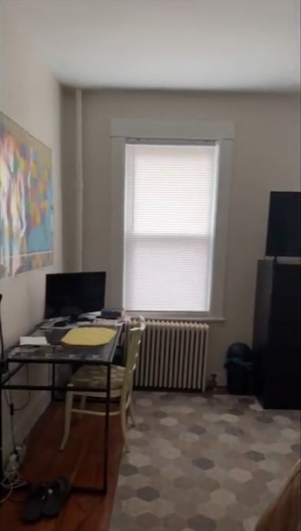 23 Inman Street, Unit 1 Cambridge, MA 02139 - Photo 4 of 20 a workspace with furniture and a window