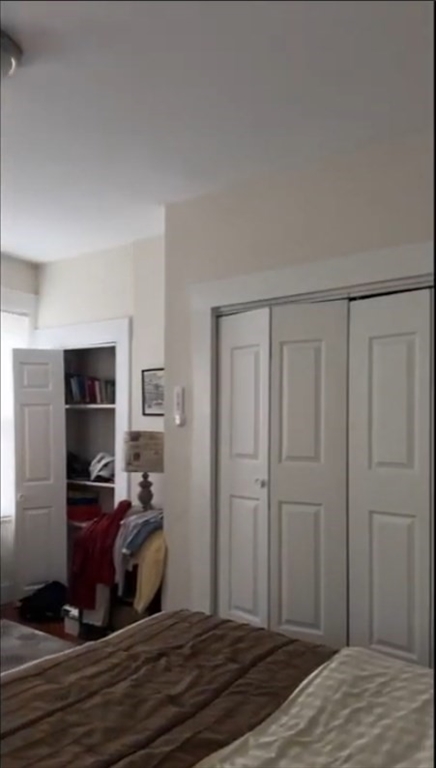 23 Inman Street, Unit 1 Cambridge, MA 02139 - Photo 7 of 20 a room with wooden floor and furniture