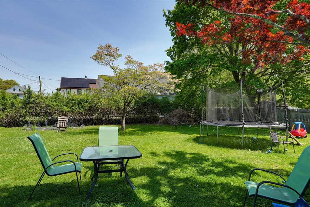 5 Eddy Street, Unit 2 Webster, MA 01570 - Photo 8 of 18 a view of a chair and table in the garden