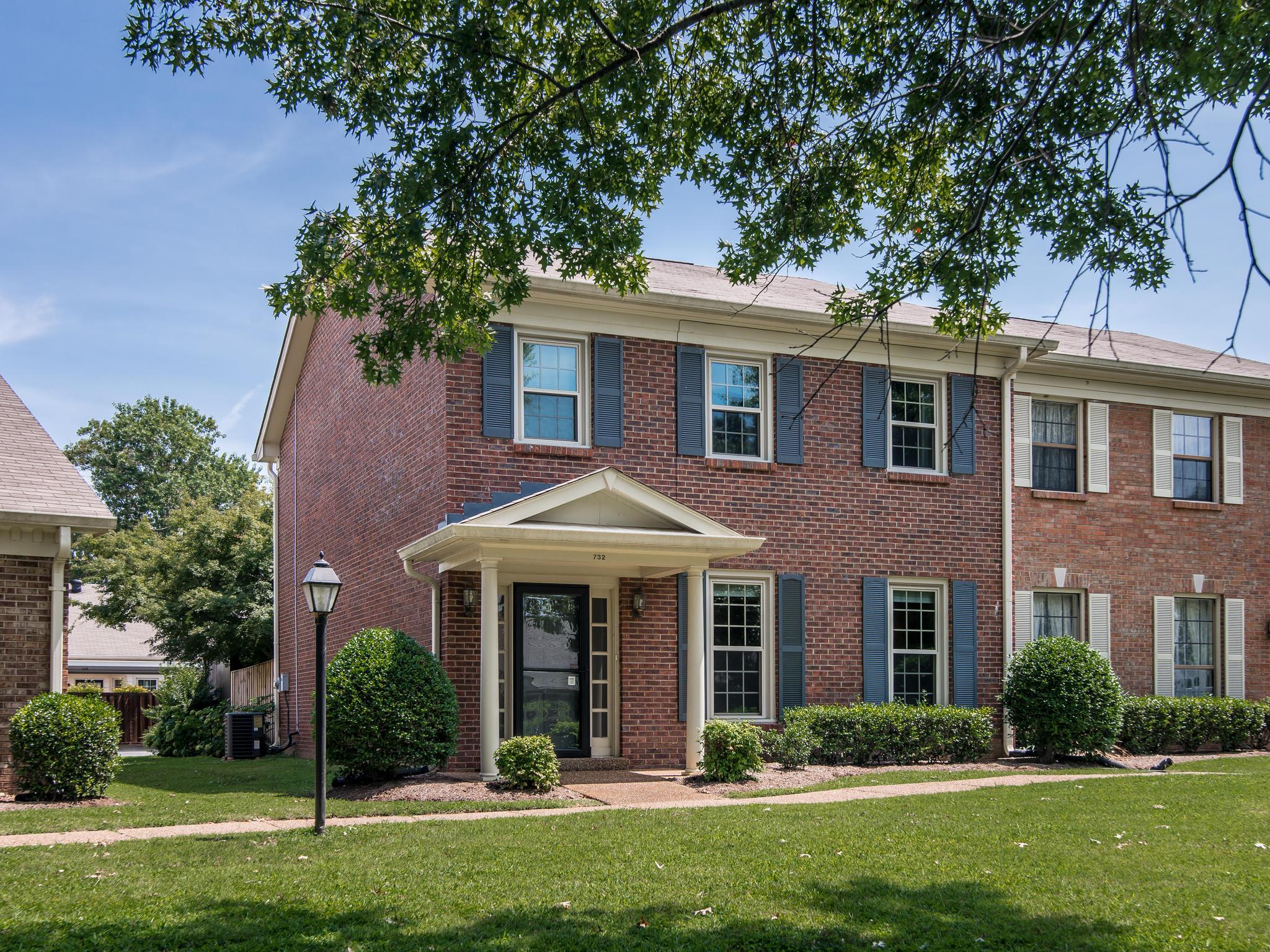 732 General George Patton Road, Unit 732 Nashville, TN 37221 - Photo 1 of 27 front view of a brick house with a yard