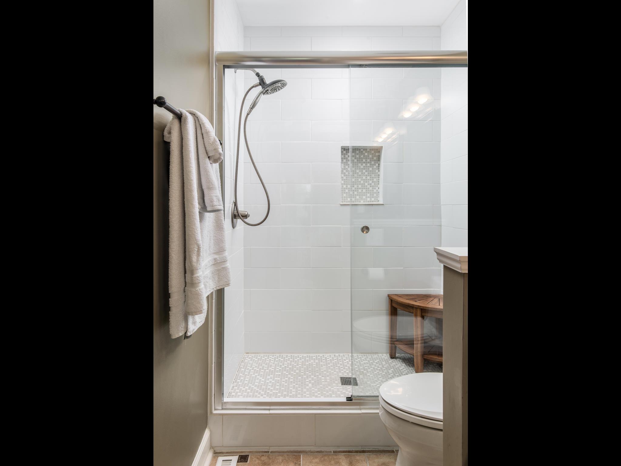 732 General George Patton Road, Unit 732 Nashville, TN 37221 - Photo 19 of 27 a bathroom with a glass shower door