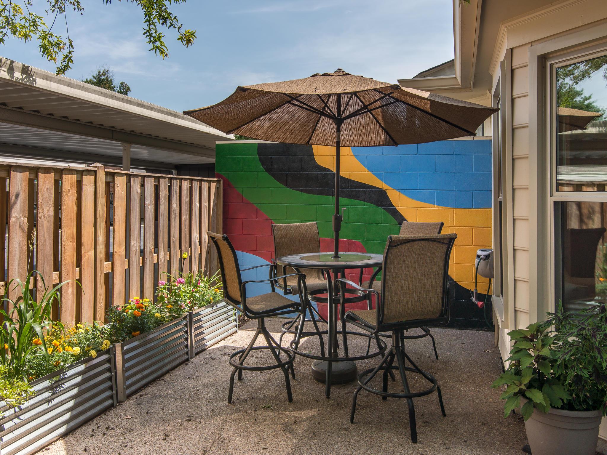 732 General George Patton Road, Unit 732 Nashville, TN 37221 - Photo 25 of 27 a table and chairs under an umbrella