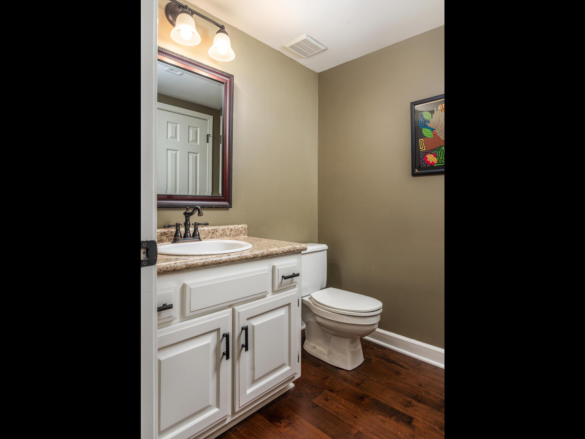732 General George Patton Road, Unit 732 Nashville, TN 37221 - Photo 8 of 27 a bathroom with a toilet sink and mirror