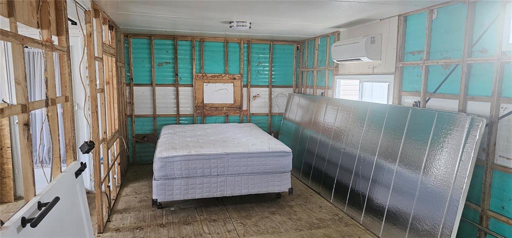 10315 Cortez Road West, Unit 11B Bradenton, FL 34210 - Photo 12 of 27 a bedroom with a bed and large window