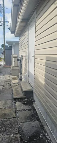 a bathroom with a granite countertop shower a sink and a mirror