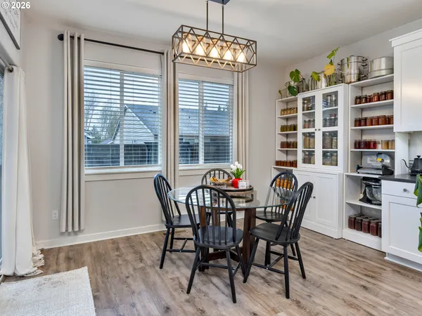 a view of a dining room with furniture and a window