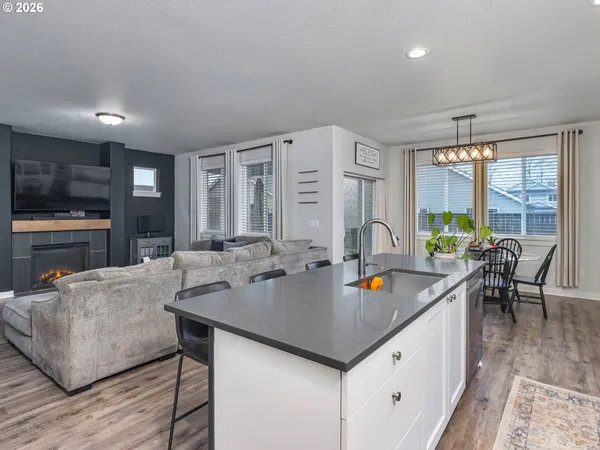 a view of kitchen island a sink and living room