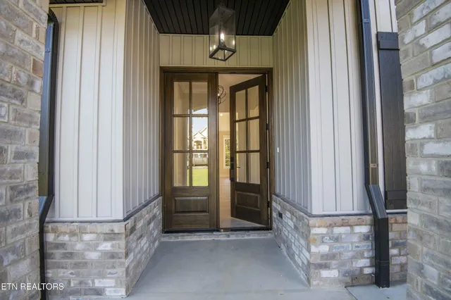 a large white kitchen with lots of counter space wooden floor and appliances