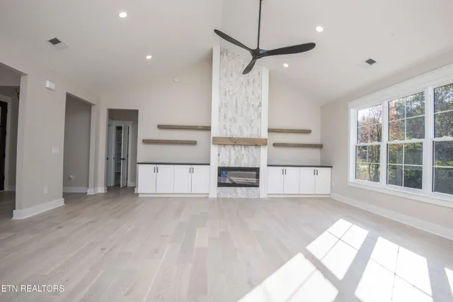 a kitchen with stainless steel appliances a sink stove and cabinets
