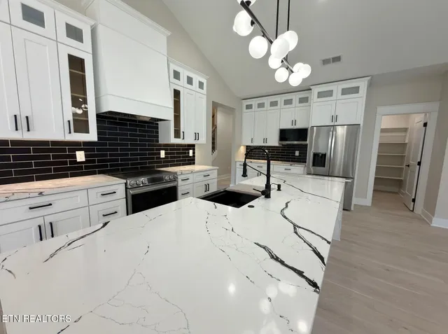 a bathroom with a bathtub and a sink