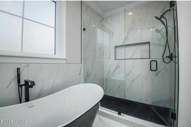 a bathroom with a sink a toilet and a bathtub