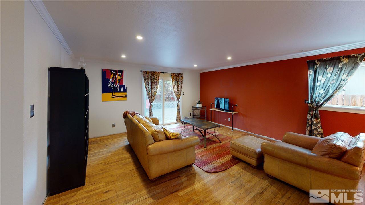 3330 Kings Row Reno, NV 89503 - Photo 18 of 35 a living room with furniture and a flat screen tv