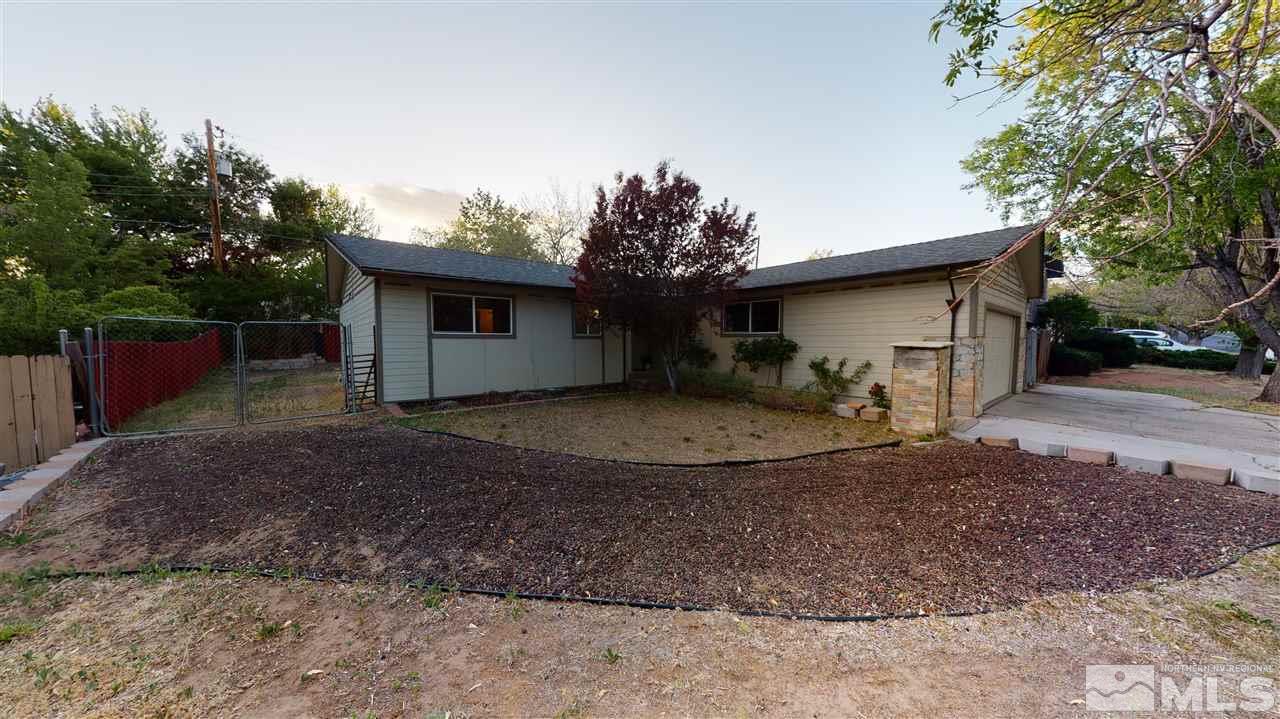 3330 Kings Row Reno, NV 89503 - Photo 4 of 35 a view of a house with a yard and garage