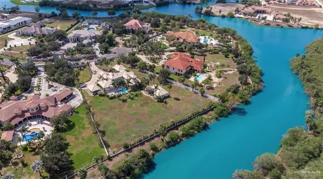 an aerial view of waterside residential houses with outdoor space