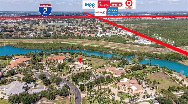 an aerial view of a house with a lake view