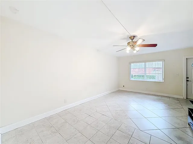 a view of an empty room with a window