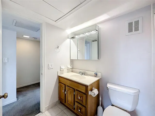 a bathroom with a sink a toilet and a bathtub