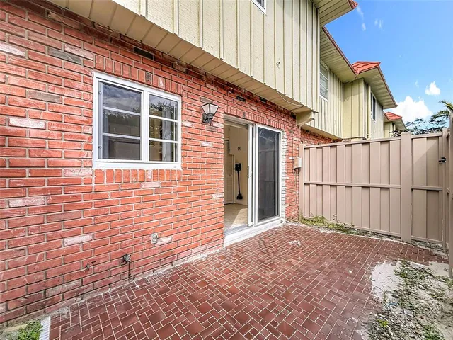 a view of backyard with small cabin